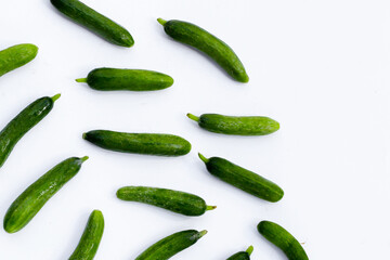 Mini cucumbers on white background.