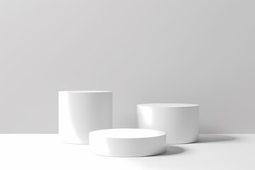 Three white cylinder podiums on a white background. Minimalist product display stand or pedestal for advertising.