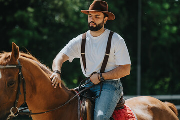 Confident man horseback riding in nature, wearing casual attire with a cowboy hat, jeans, and suspenders. Outdoors activity and equestrian sport concept.