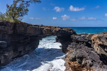 Lava rock Sea Arch, Makahuena Light, Koloa, Kauai South Shore，Hawaii. Koloa Volcanics	
