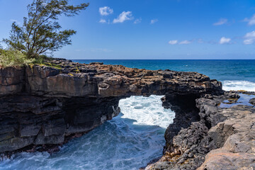 Lava rock Sea Arch, Makahuena Light, Koloa, Kauai South Shore，Hawaii. Koloa Volcanics	
