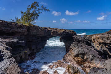 Lava rock Sea Arch, Makahuena Light, Koloa, Kauai South Shore，Hawaii. Koloa Volcanics	
