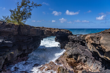 Lava rock Sea Arch, Makahuena Light, Koloa, Kauai South Shore，Hawaii. Koloa Volcanics	
