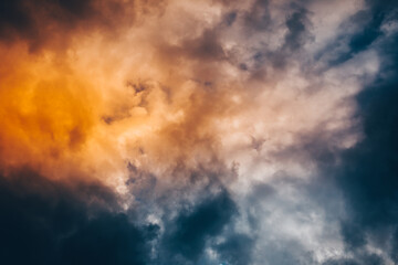 The sky and clouds are orange and blue with vignetting at the edges.