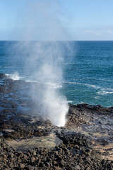 A blowhole on Kauai's south shore near Poipu, Hawaii, USA. 
The blowhole shoots seawater through its natural lava tube up to 50 feet in the air.
