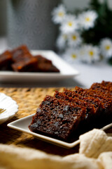 Kek Buah Kukus, a traditional Malaysian steamed fruit cake filled with dried fruits, nuts, and spices, enjoyed during celebrations.