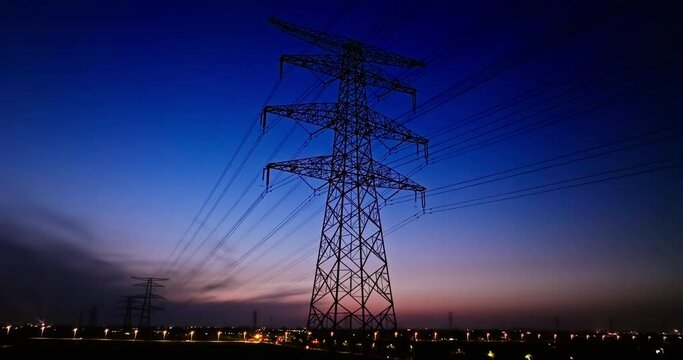 Motion shot of electricity pylon. Industrial background