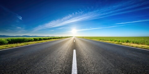 Fototapeta premium Asphalt road stretching into the horizon under clear blue sky , asphalt, road, highway, transportation, infrastructure