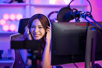 Asian young audio DJ woman sing a song on microphone to broadcasting. 