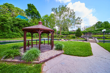 Serene Gazebo in Sunken Gardens Park with Stone Pathway and Bridge