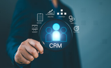 Businessman show CRM Customer Relationship Management for business sales marketing system concept presented in futuristic graphic interface of service application to support CRM database analysis.