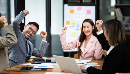 Group of Young Asian business team creative coworker, teamwork celebrating achievement  in creative in modern office