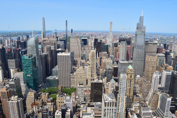 Looking north from the Empire State, this image captures the bustling midtown Manhattan skyline on a clear day in New York City
