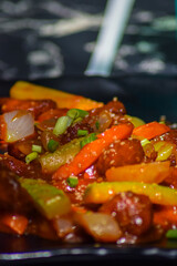 Tasty sweet and sour chicken in plate
