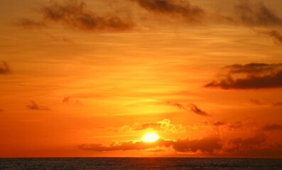 The morning sun rising above the ocean off the Florida coast during the summer
