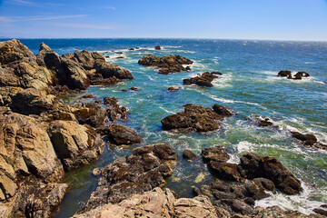 Rugged Rocks and Swirling Ocean Waves at Chetco Point Park Aerial View