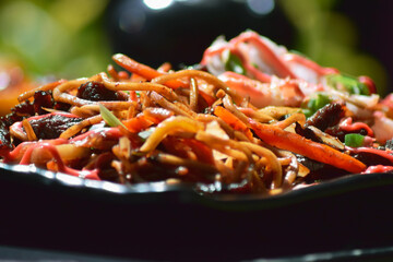Asian noodles with beef meat and vegetables 