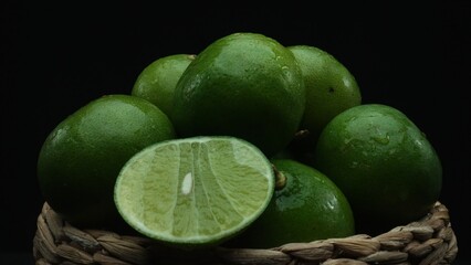 Macrography of sliced lime, vibrant citrus slice are meticulously arranged within a charming wooden...