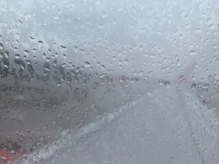 Close up raindrop on aircraft window.