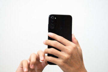 Man's hand holding a smart phone screen view from above. isolated in white background