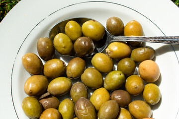 Close-up of green olives in a bowl 