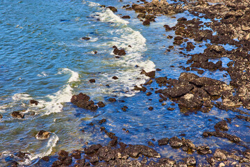 Rocky Coastline and Ocean Waves Aerial View
