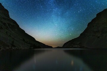 Night landscapes with beautiful starry sky and the Milky Way against the backdrop of a mountain lake in the Canadian Rockies
