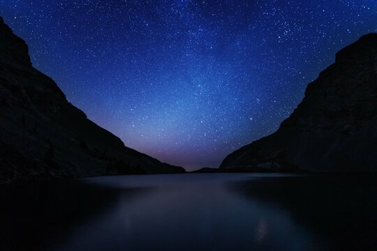 Night landscapes with beautiful starry sky and the Milky Way against the backdrop of a mountain lake in the Canadian Rockies