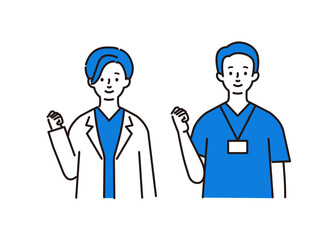 ガッツポーズをする医療従事者の男女