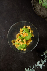 Refreshing Apple Ice Cream with Baked Apple Toppings on Dark Background