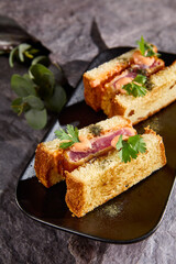 Delicious Japanese Tuna Sando Sandwich with Fresh Herbs on Slate Plate