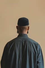 muslim man standing on solid background