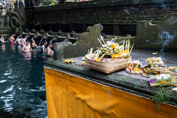Bathers purify and cleanse themselves at the Holy Springs of Tetra Empul. The springs are found near Ubud, Bali