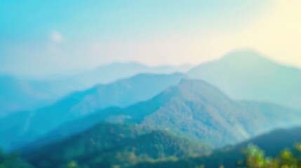 Fototapeta premium A blurred background of a mountain landscape under a gradient of blue skies, highlighting natural beauty