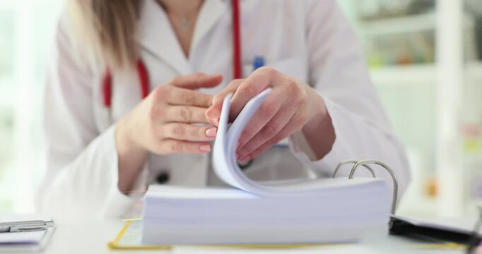 Doctor analyzes large folder containing patient documents