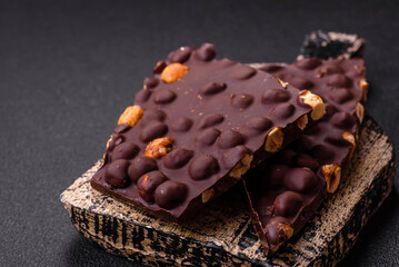 Black bitter chocolate with whole hazelnuts, candied fruits and mint