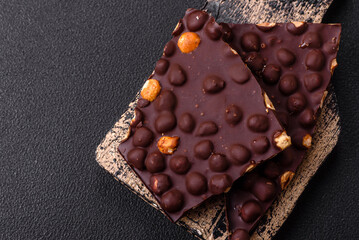 Black bitter chocolate with whole hazelnuts, candied fruits and mint