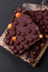 Black bitter chocolate with whole hazelnuts, candied fruits and mint