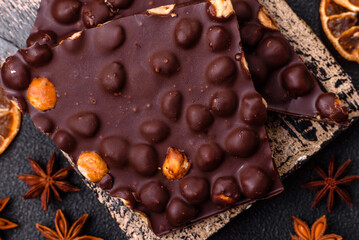 Black bitter chocolate with whole hazelnuts, candied fruits and mint