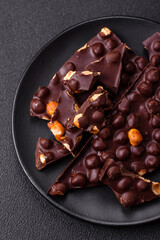 Black bitter chocolate with whole hazelnuts, candied fruits and mint