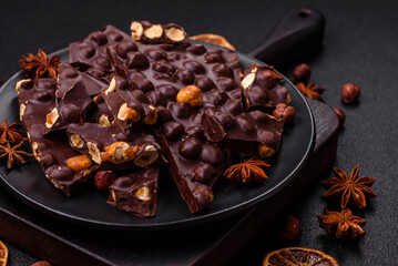 Black bitter chocolate with whole hazelnuts, candied fruits and mint