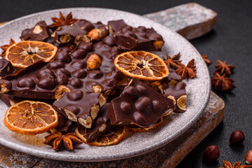 Black bitter chocolate with whole hazelnuts, candied fruits and mint