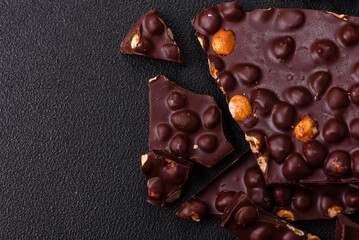 Black bitter chocolate with whole hazelnuts, candied fruits and mint