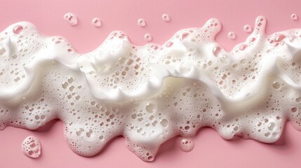 A pink background with a white foam line that appears to be a wave