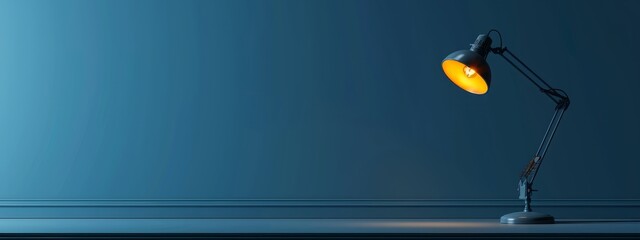  A desk lamp sits atop a table, beside another with a yellow light