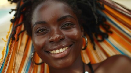 a close-up a young smiling african, american woman relax in hammock on beach