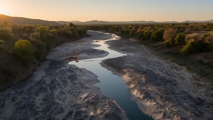 dried-up riverbed and parched landscape representing severe drought conditions and water scarcity