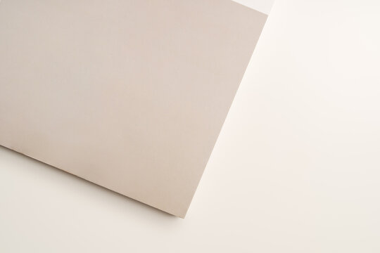 Stack of blank paper on beige background