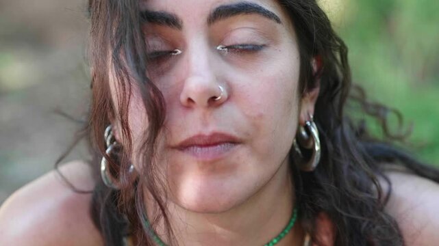 Close-up of young woman showing deep sadness