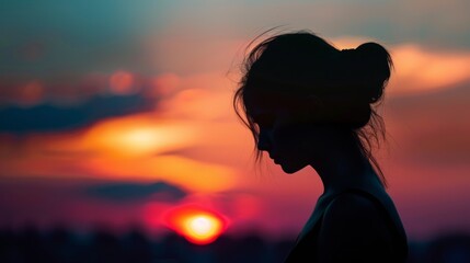 silhouette of sad woman in sunset with emotional lighting and composition for impactful image.